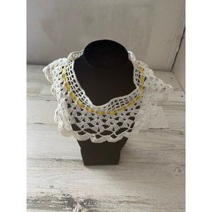 White crocheted collar with yellow ribbon closure